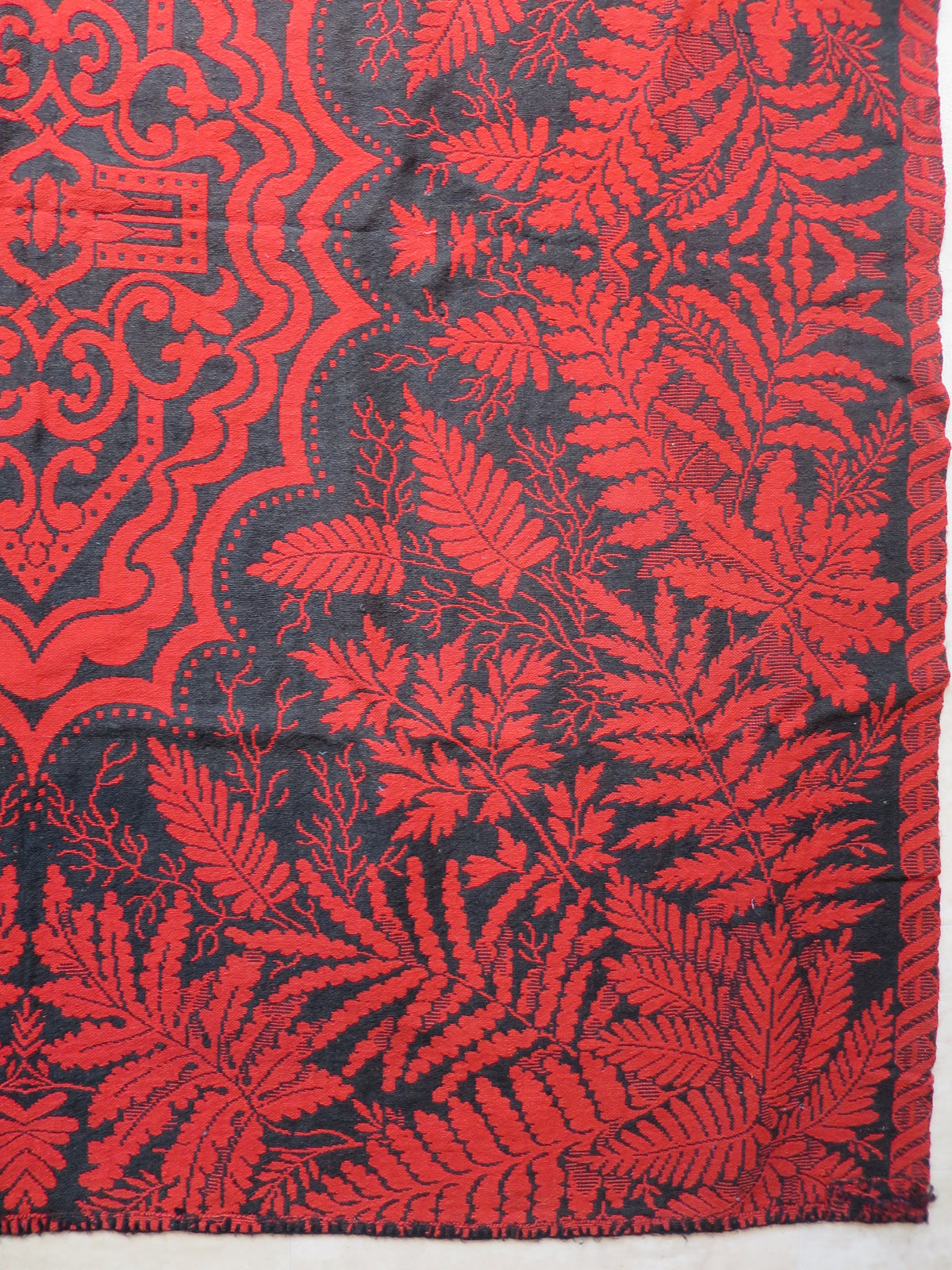 Detailed view of the dense fern and foliage weave on a heavy weight 2.2 kg antique wool double-weave coverlet blanket.