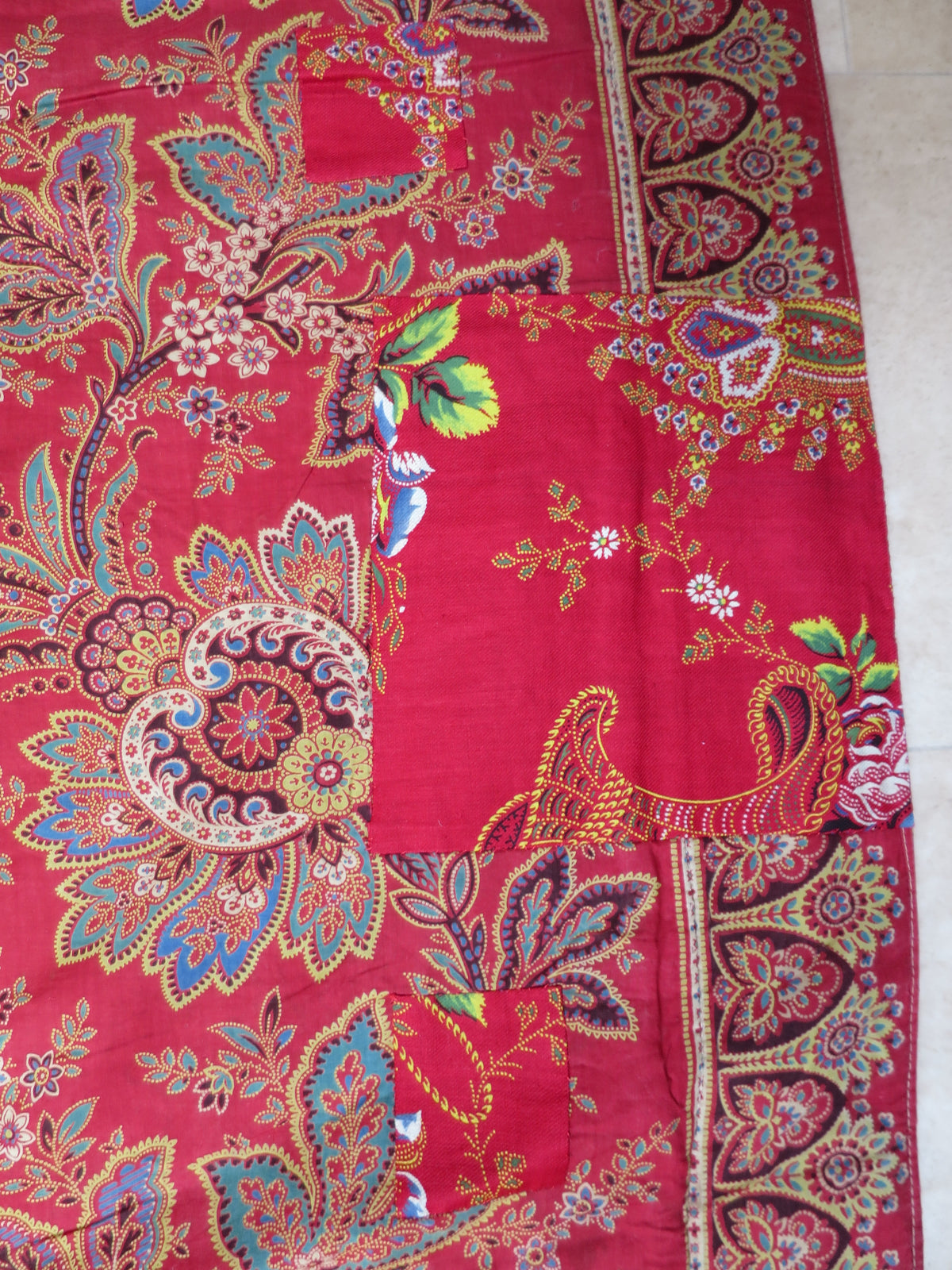 Period patch repair on the quilt's madder chintz reverse