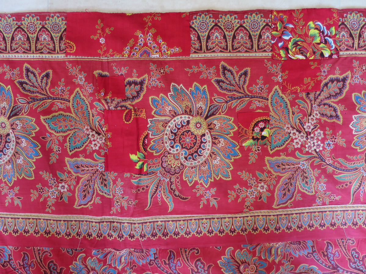 Period patch repair on the quilt's madder chintz reverse