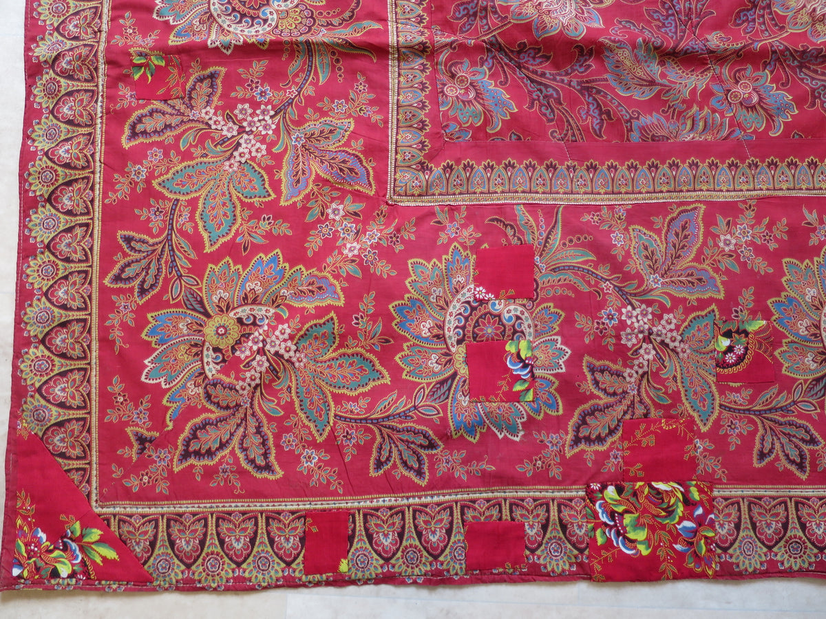 Period patch repair on the quilt's madder chintz reverse
