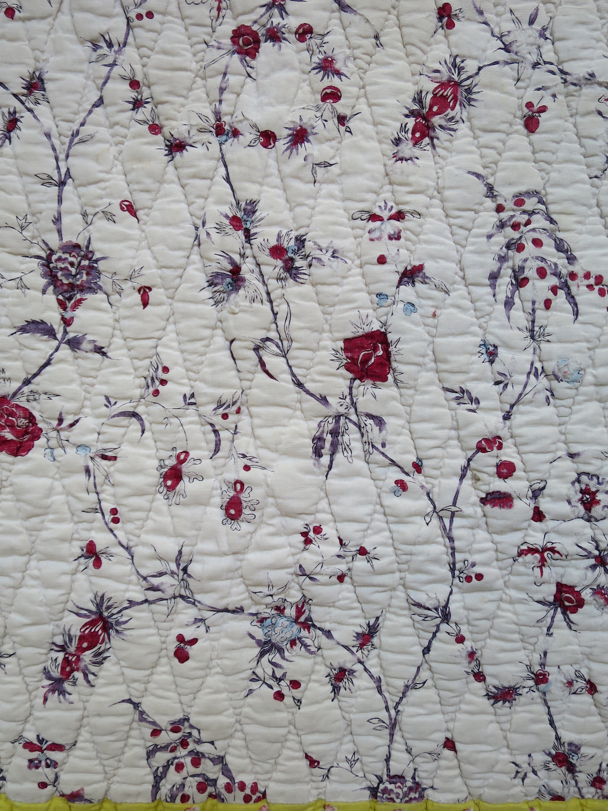 Detail of the block-printed floral chintz on the quilt front