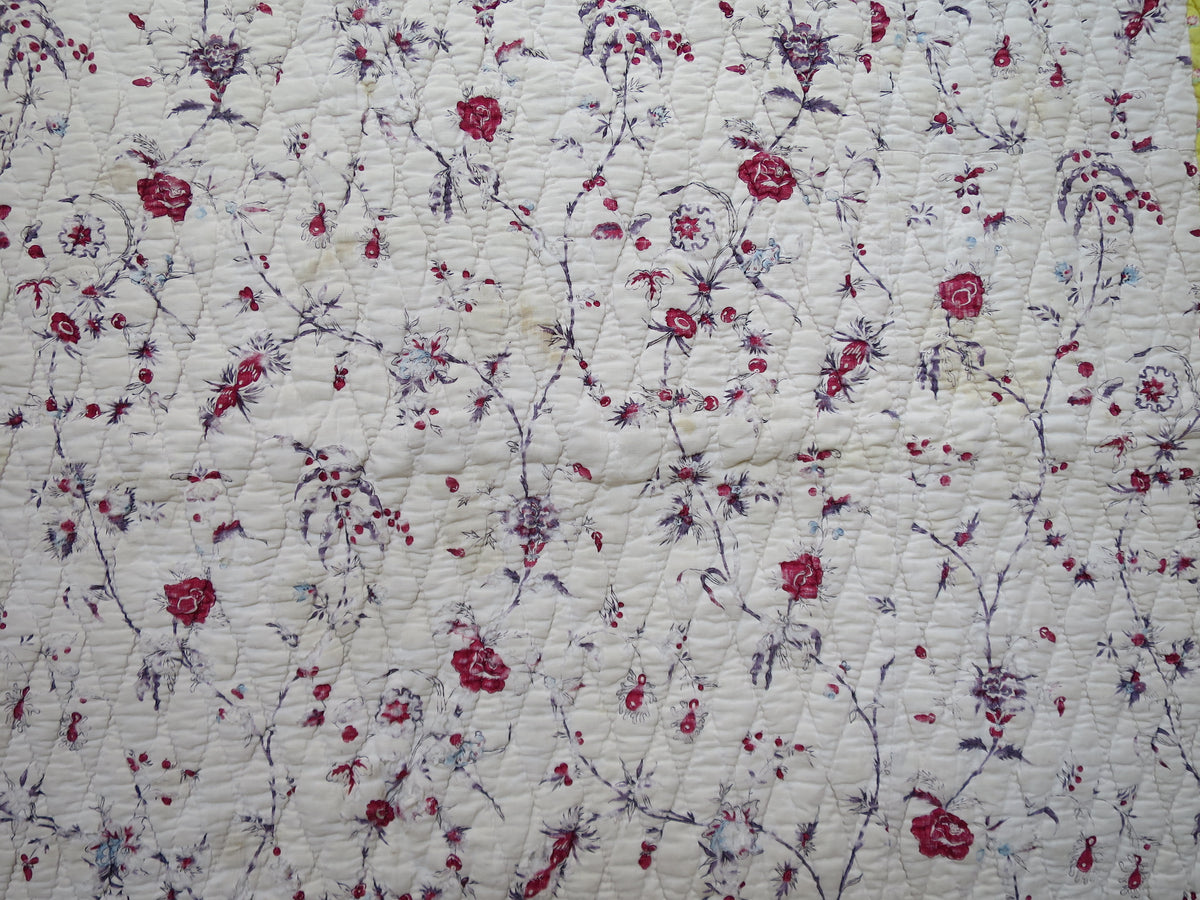 Detail of the block-printed floral chintz on the quilt front