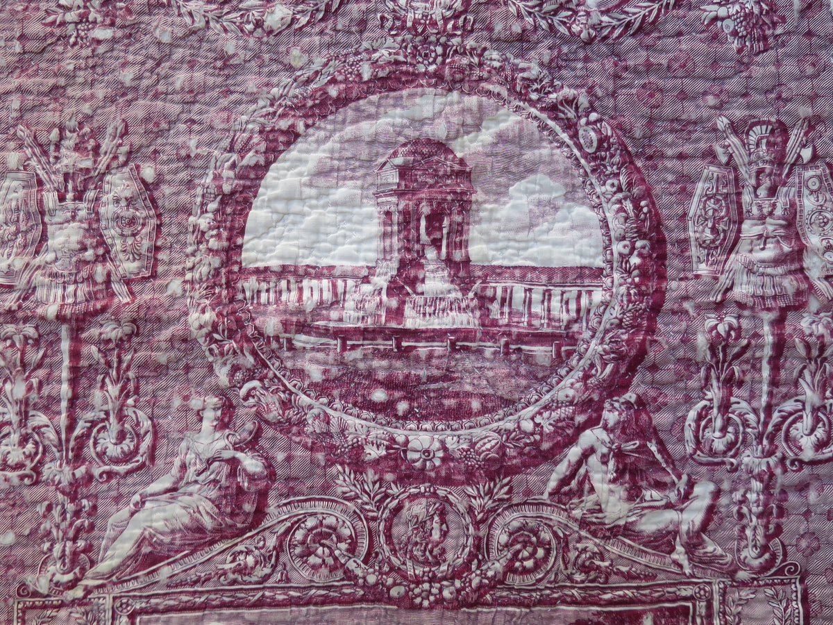 Detail of the plum roller-printed toile on the quilt, showing an architectural scene from Les Monuments de Paris
