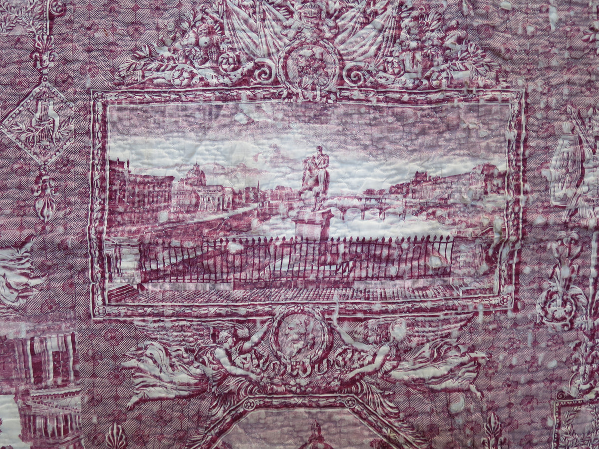 Close view of a Paris monument and surrounding figures in the quilt’s Les Monuments de Paris toile panel.