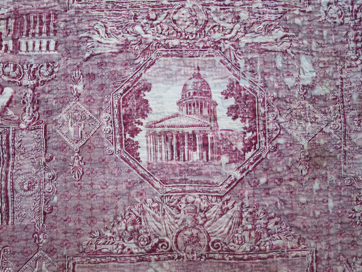 Architectural detail in the plum-coloured Les Monuments de Paris print stitched onto the quilt.