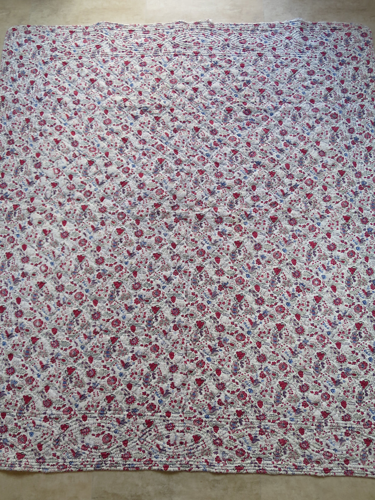 Late 18th-century French piqué quilt, indienne botanical print face with woodblock-printed floral design and penciled blue highlights, c.1775–1790
