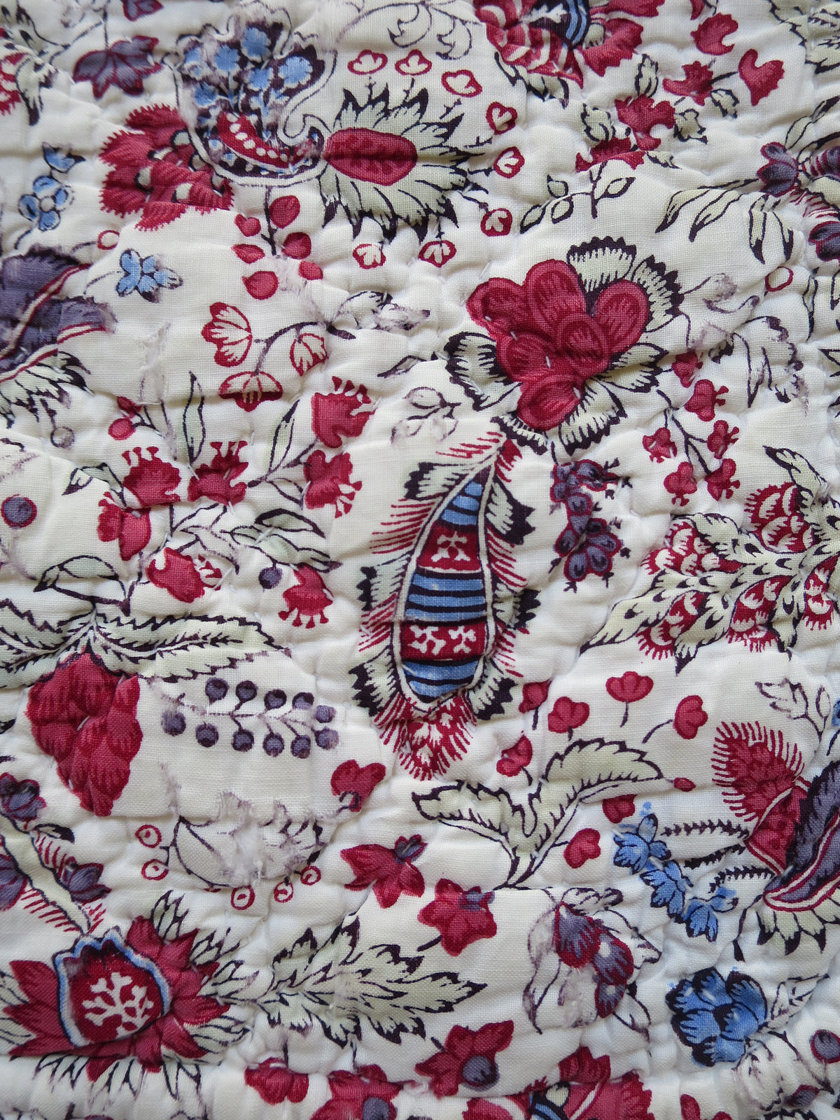Late 18th-century French piqué quilt, indienne botanical print face with woodblock-printed floral design and penciled blue highlights, c.1775–1790