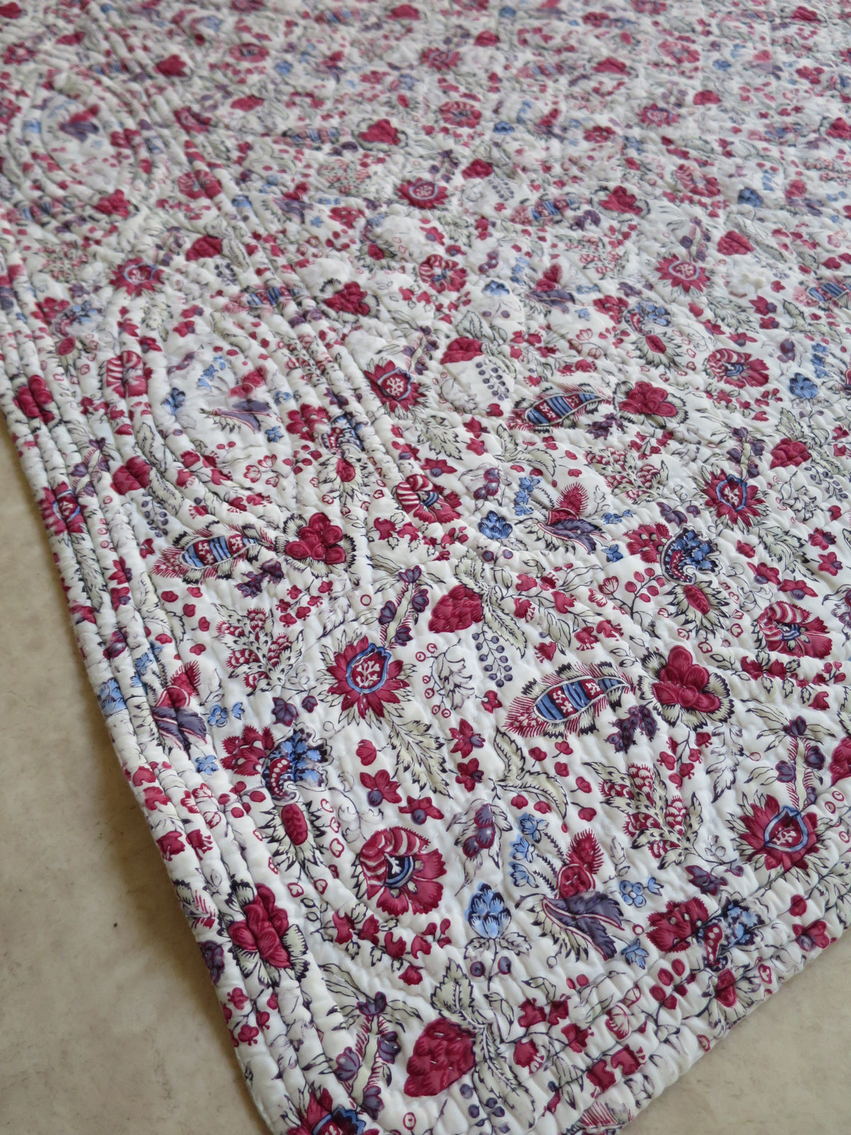 Late 18th-century French piqué quilt, indienne botanical print face with woodblock-printed floral design and penciled blue highlights, c.1775–1790