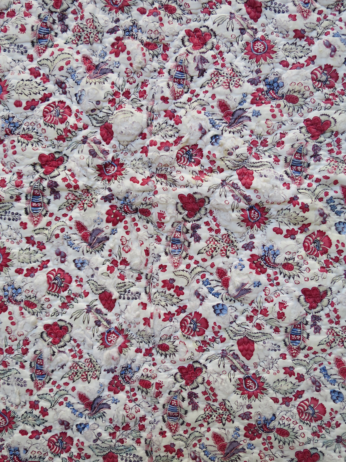 Close-up of woodblock-printed indienne botanical print with penciled blue highlights, late 18th-century French textile