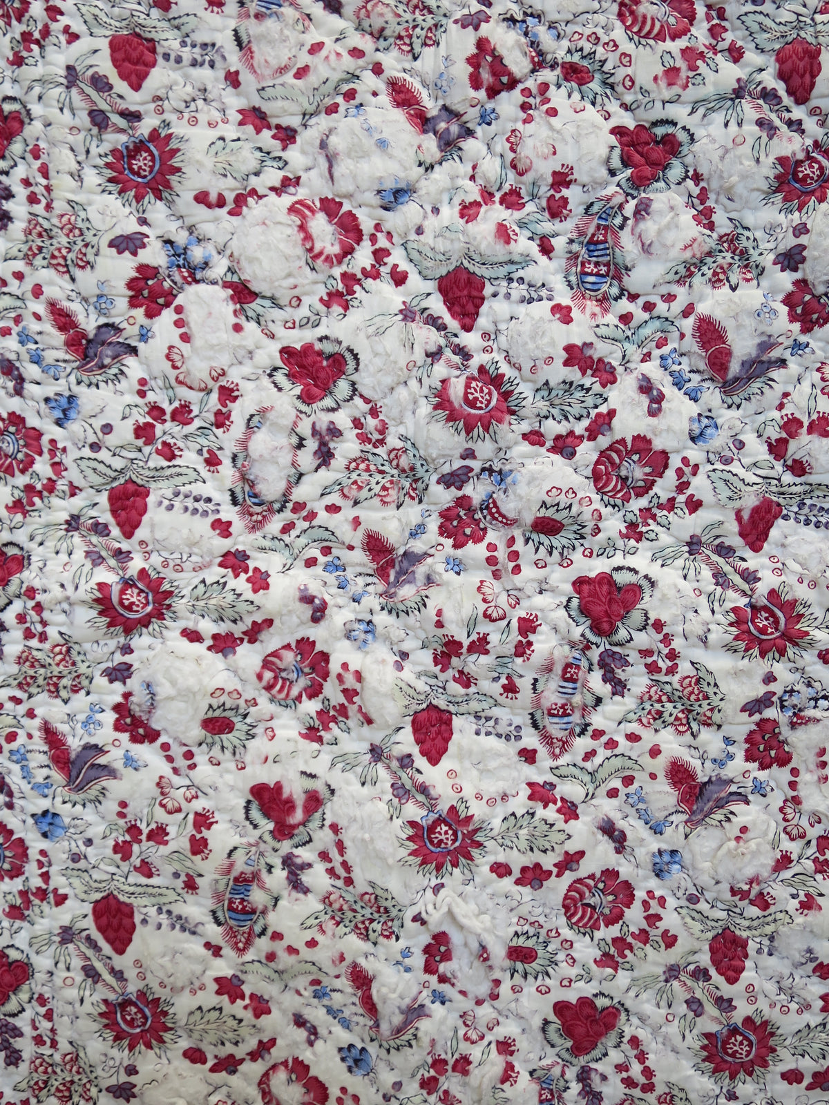 Close-up of woodblock-printed indienne botanical print with penciled blue highlights, late 18th-century French textile