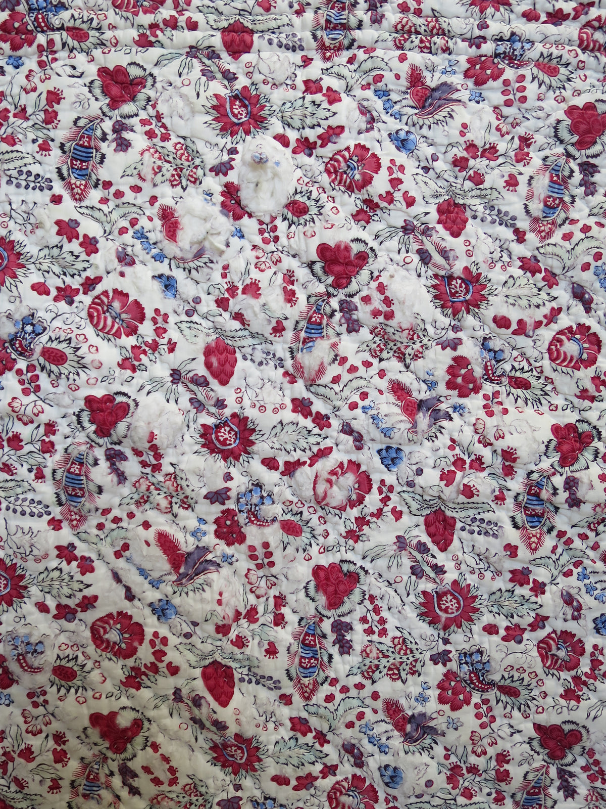 Close-up of woodblock-printed indienne botanical print with penciled blue highlights, late 18th-century French textile