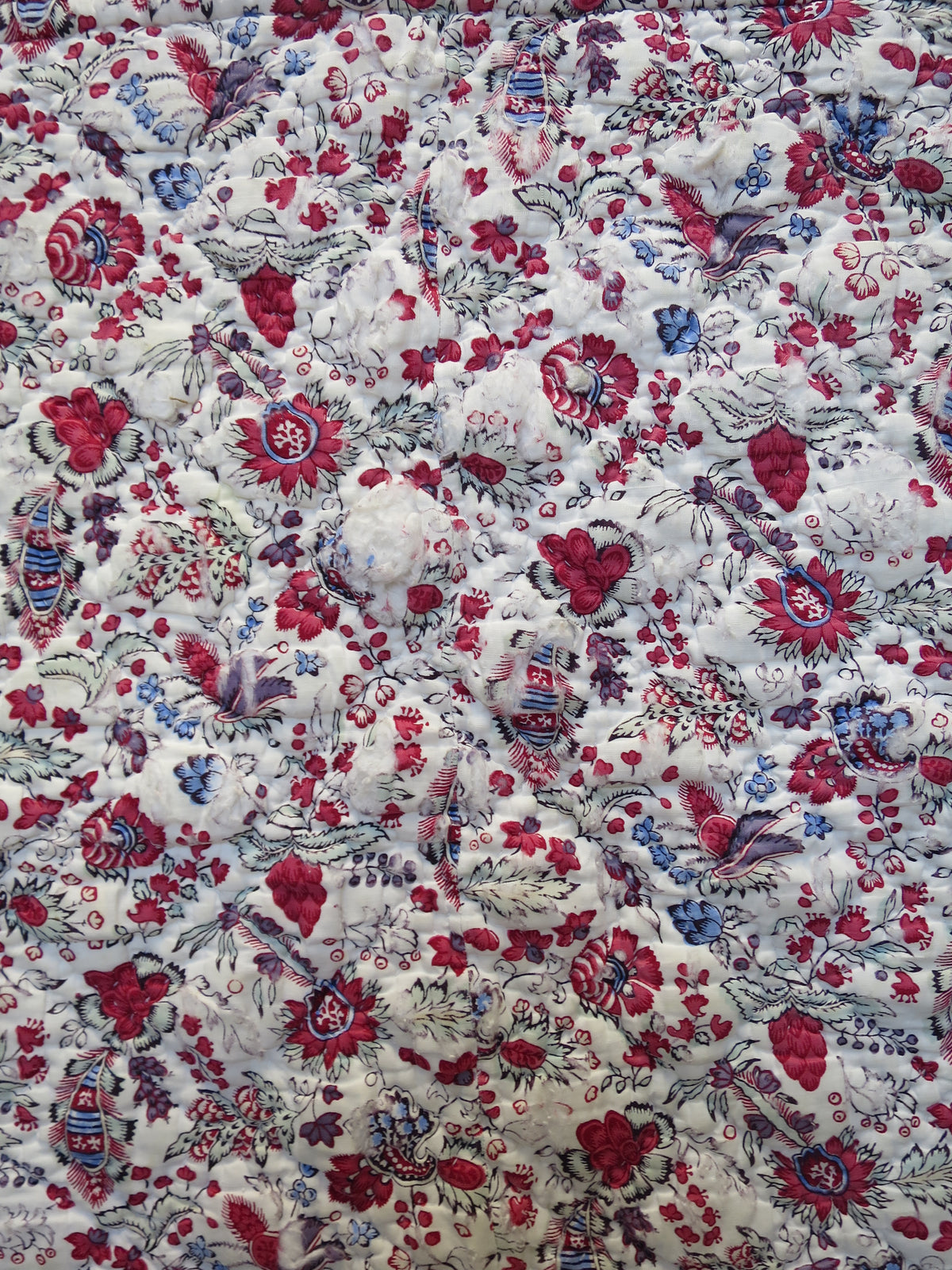 Close-up of woodblock-printed indienne botanical print with penciled blue highlights, late 18th-century French textile