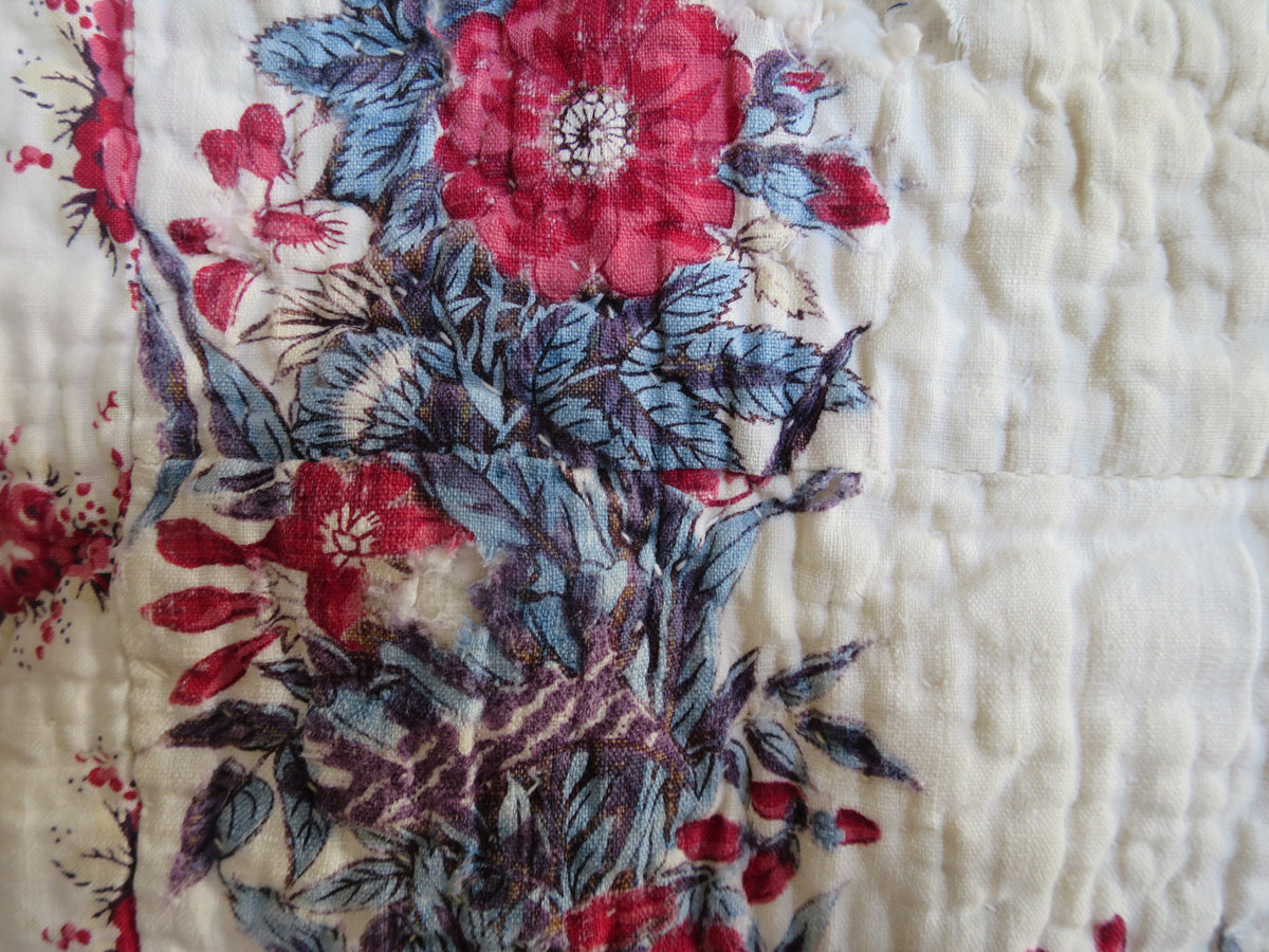 Joined section of the printed scarf at the centre of the French quilt, showing the mismatched seam.