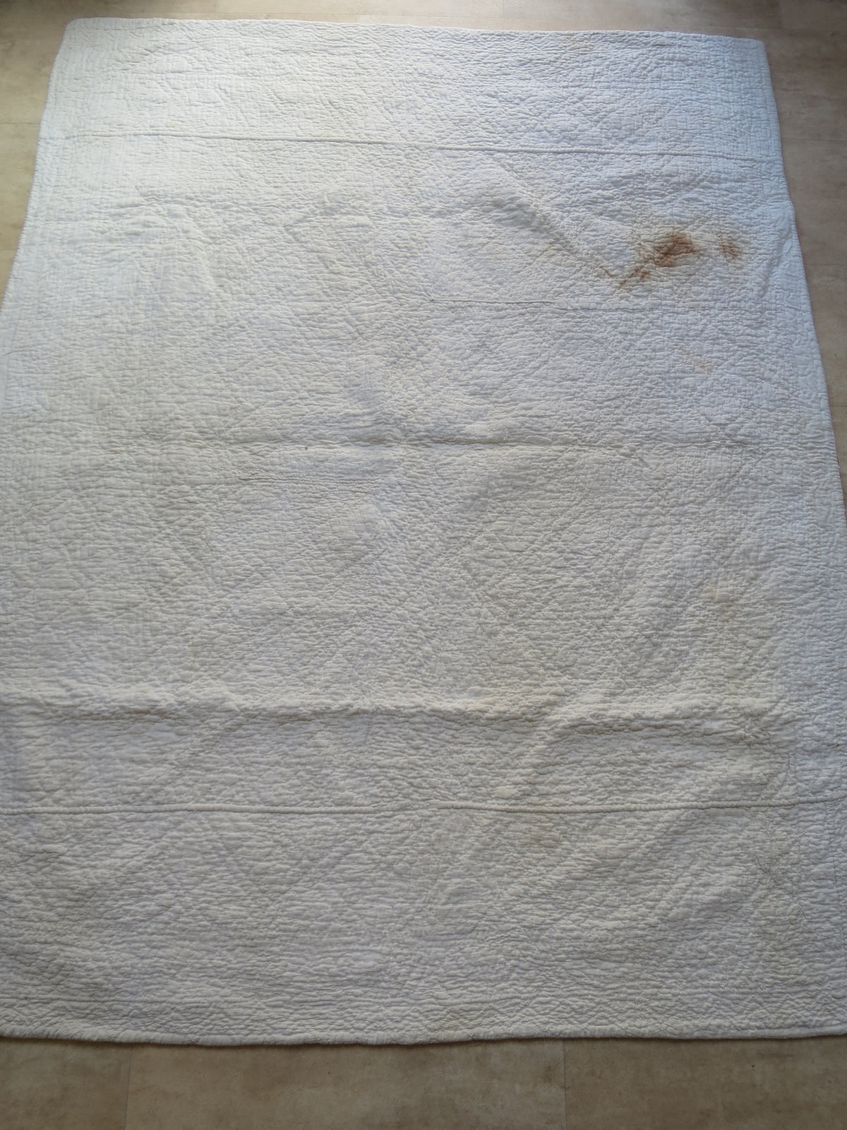 White reverse of the French reversible quilt, with diamond quilting and corded motifs.