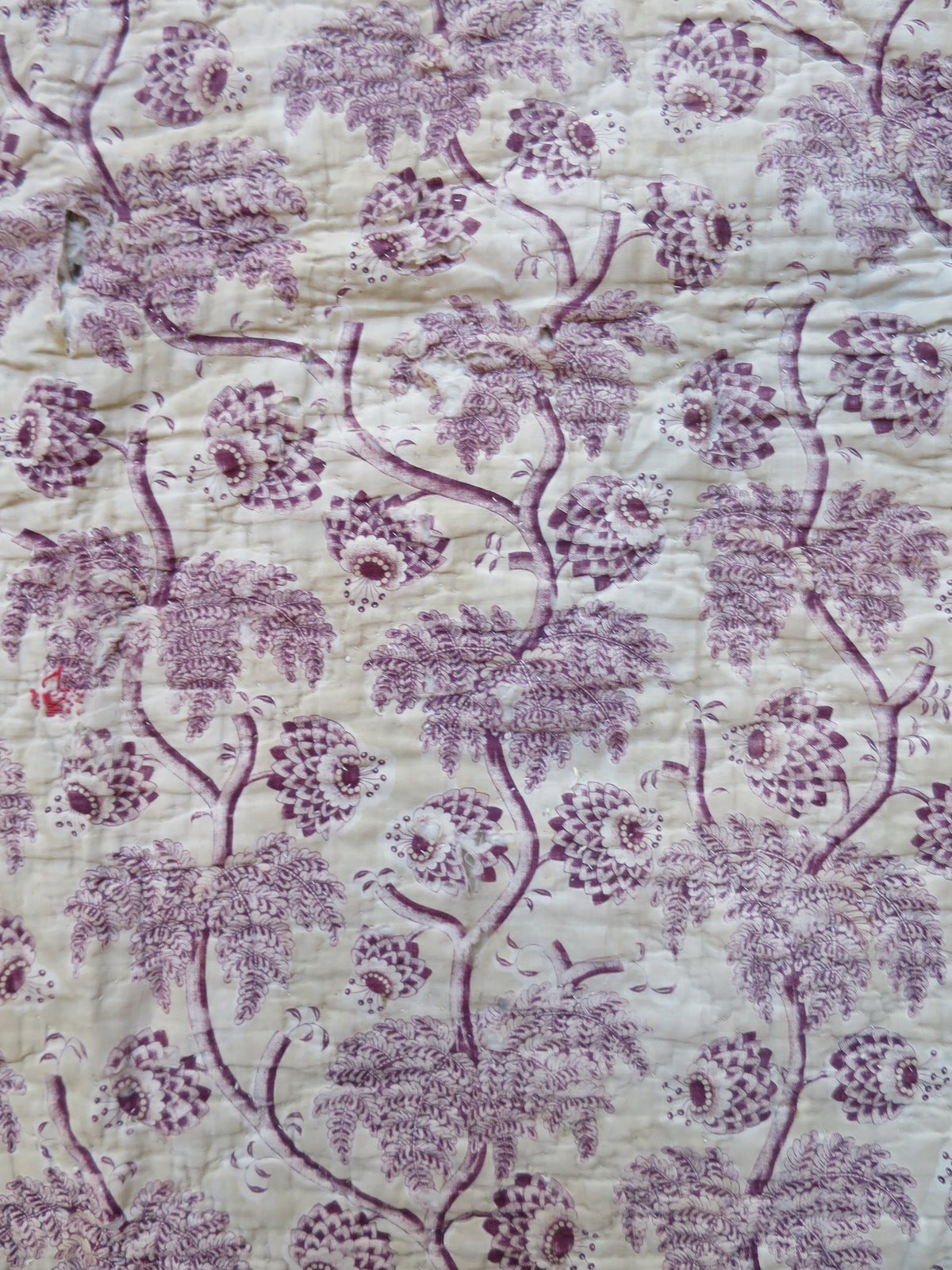 Print repeat detail on the plum block-printed front
