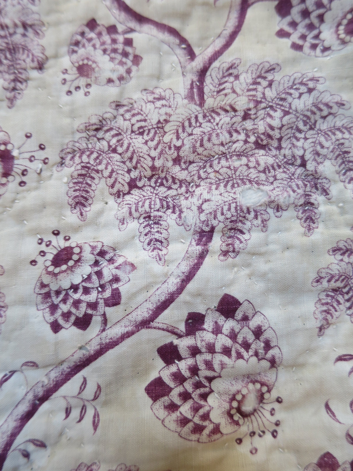Detail of the tree peony and carnation motifs on the plum print