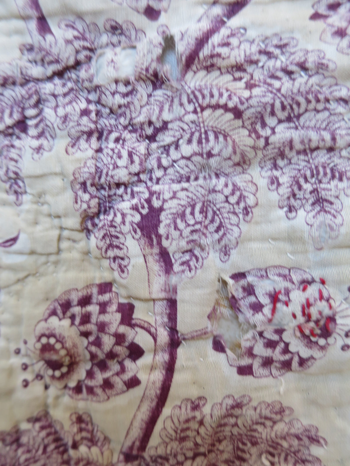 Detail of the tree peony and carnation motifs on the plum print