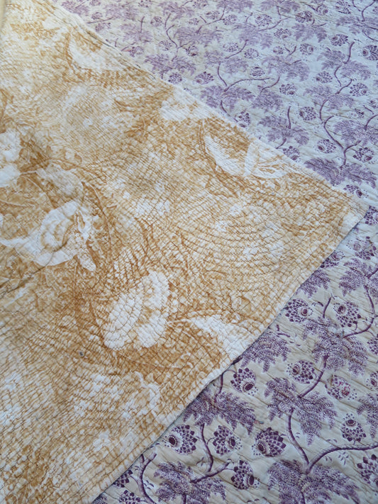 Front and reverse of an 18th-century part quilt, plum block print and ochre serpentine print