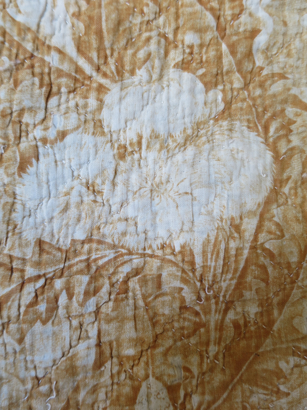 Detail of the rose motifs on the ochre reverse