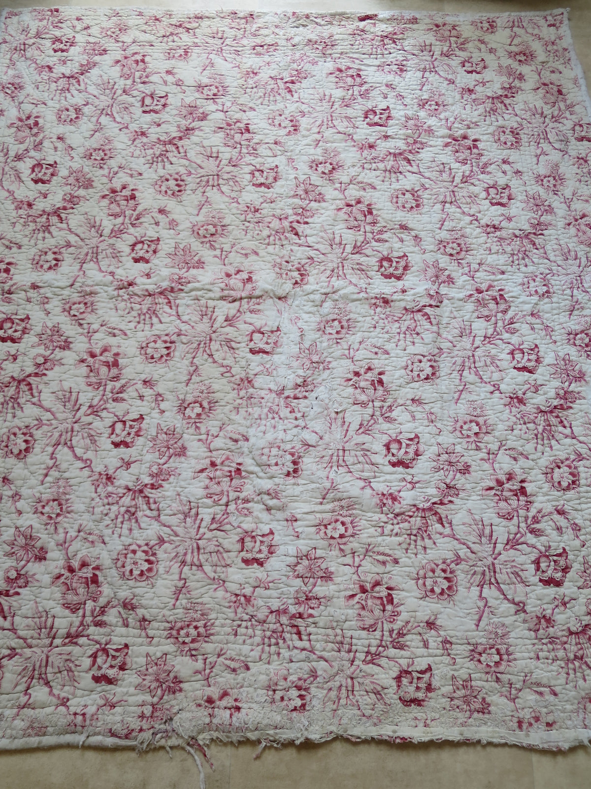 Full front view of an 18th-century French woodblock-printed madder chintz quilt