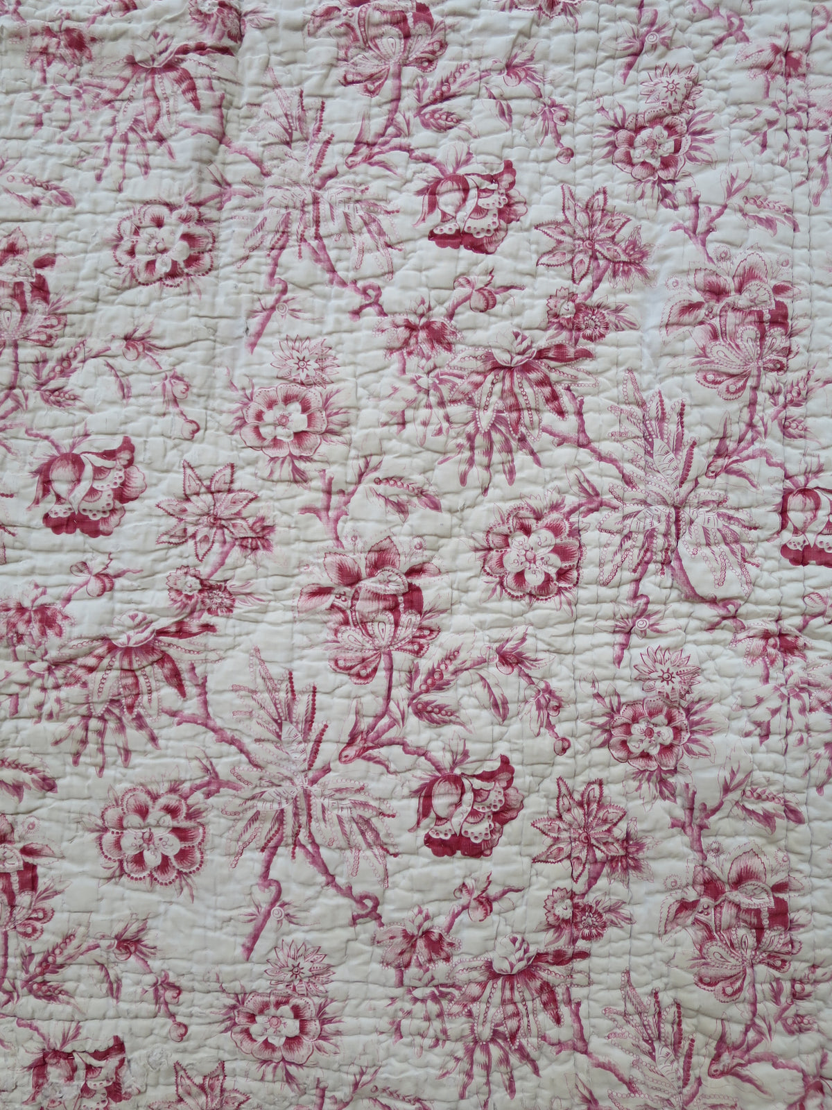 Detail of the woodblock-printed madder chintz on the quilt front