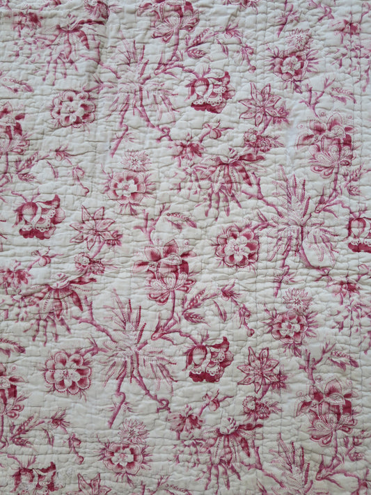 Detail of the woodblock-printed madder chintz on the quilt front