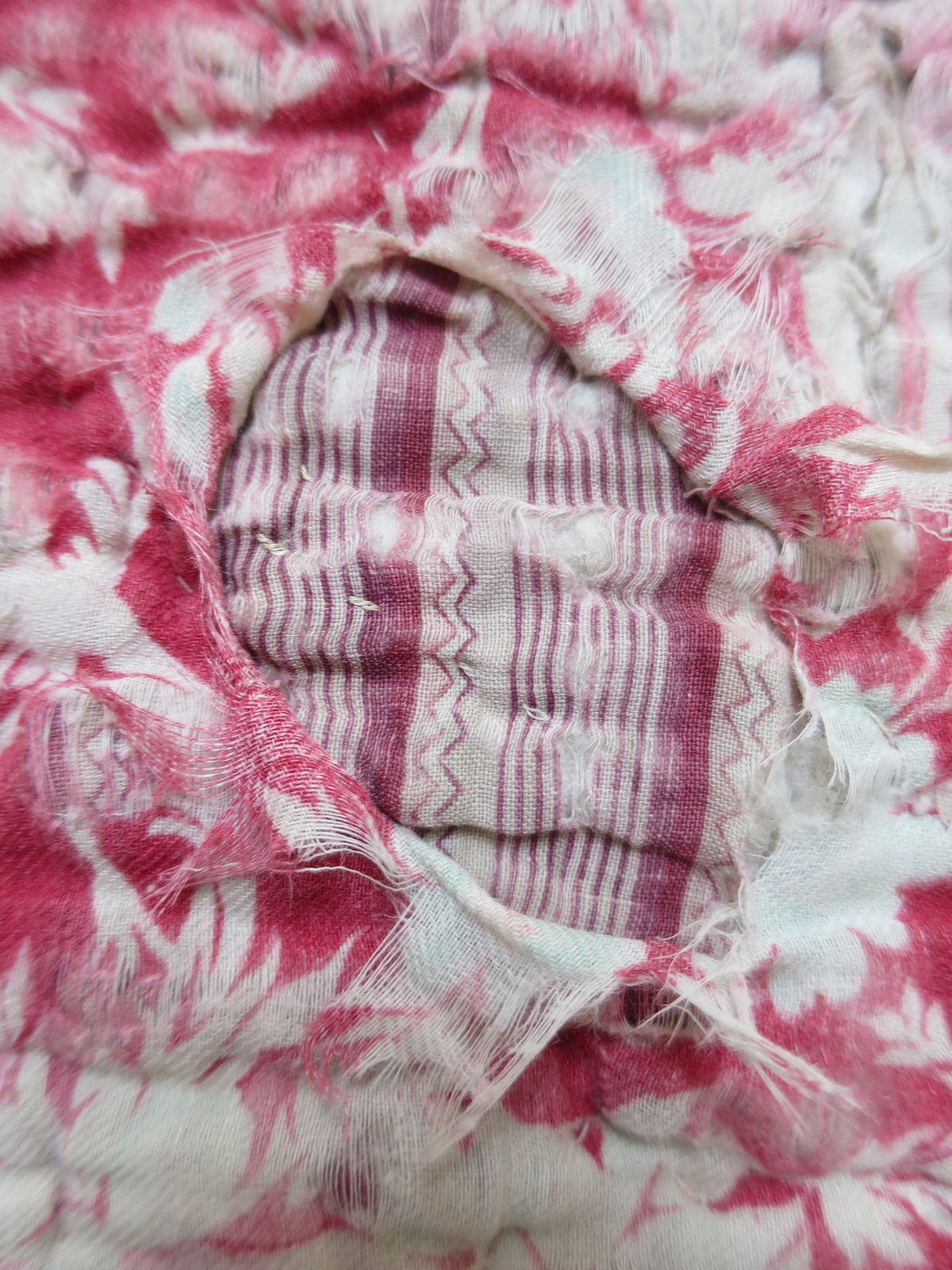 Surviving original 1780s backing fabric visible beneath the second layer