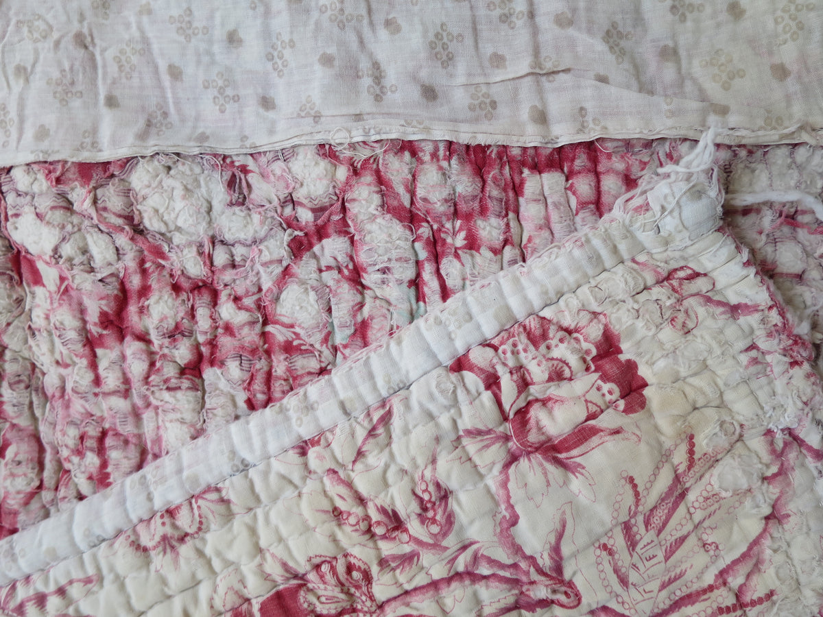 Quilt front alongside the top two historic backing layers