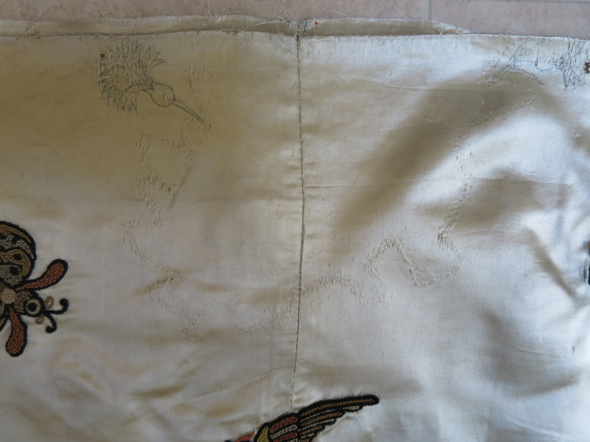 Top edge showing further drawn embroidery designs and stitch workings exposed by unpicking.