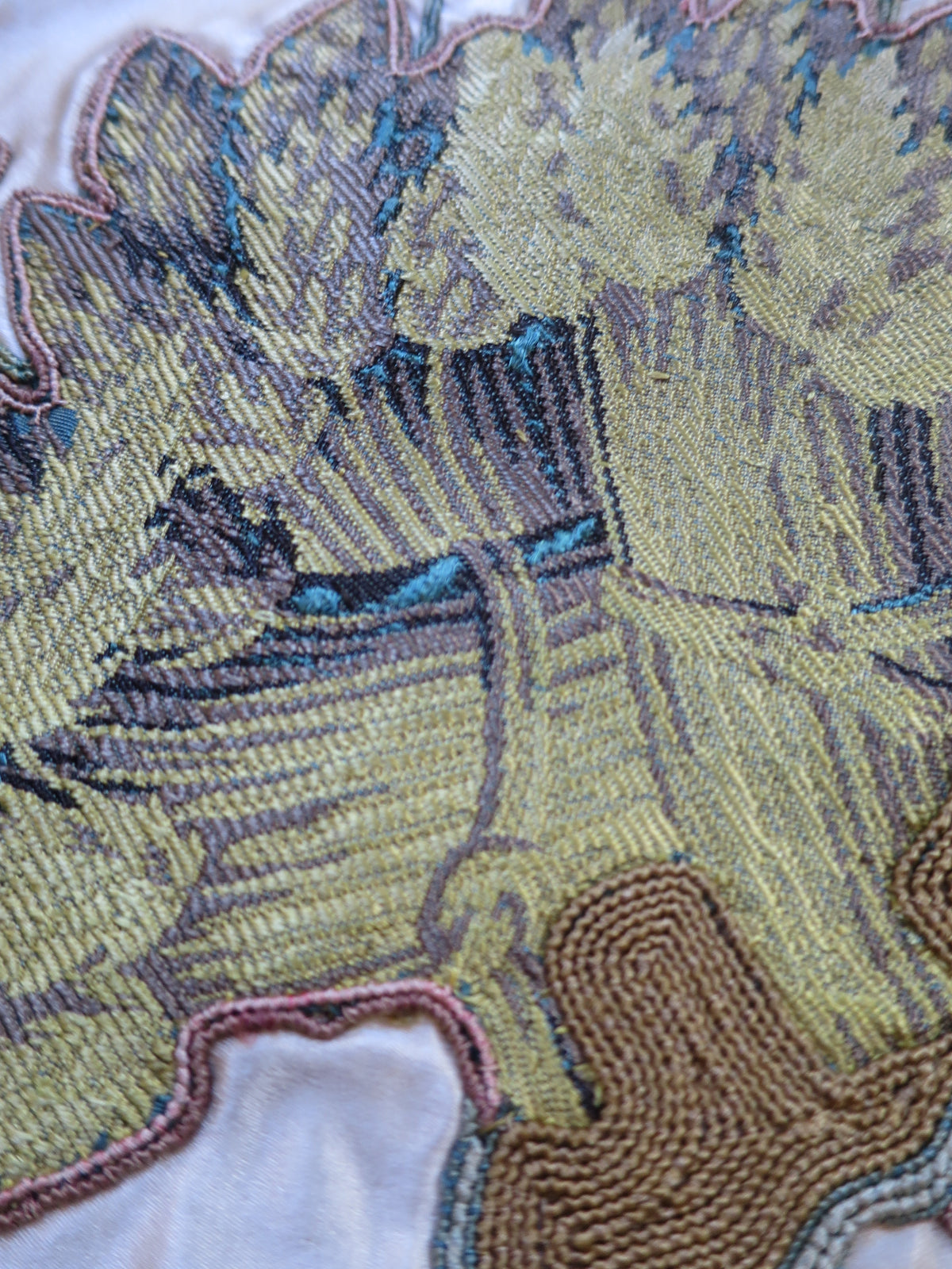 Close-up of lampas silk showing the woven motif and surface texture.