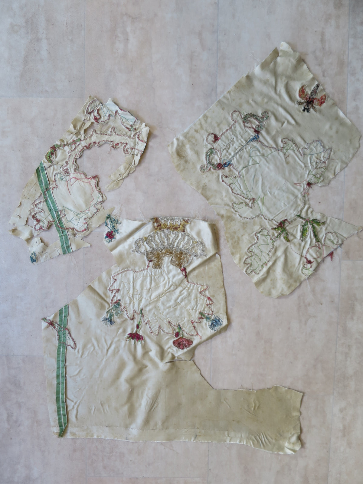 Reverse of the appliqué fragments, showing the embroidery workings and exposed threads.