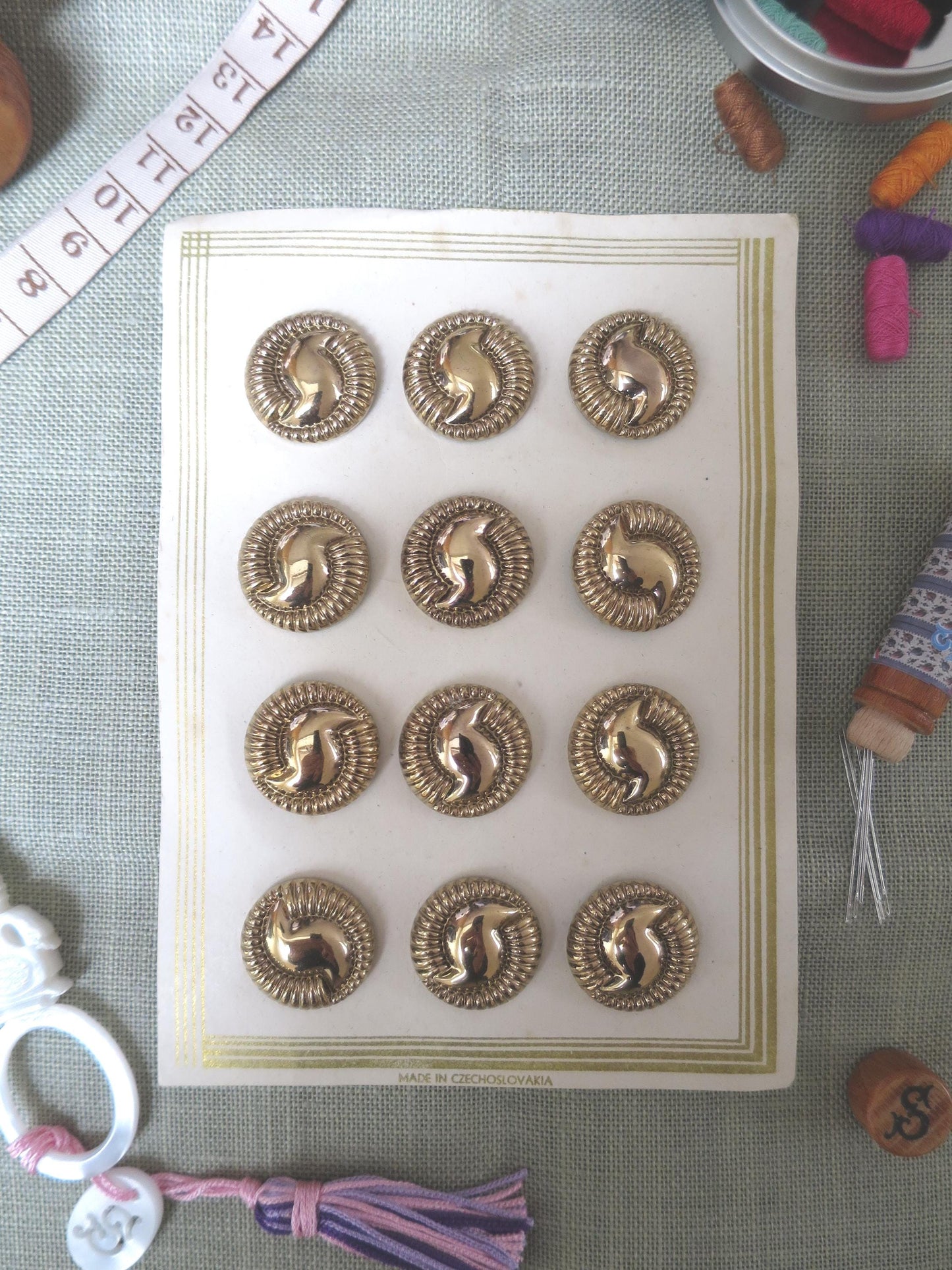 12 Antique Carded Art Deco Czechoslovakian Glass Buttons- Gold Swirl Design